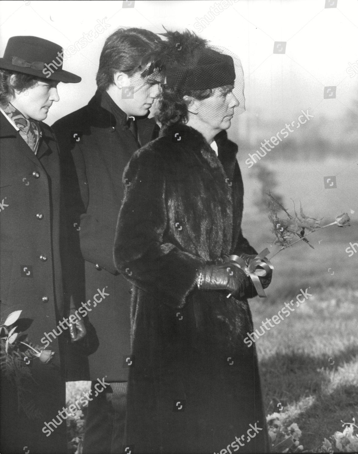Hazel Chapman, widow of Lotus car chief Colin Chapman, carrying a single red rose at his funeral.