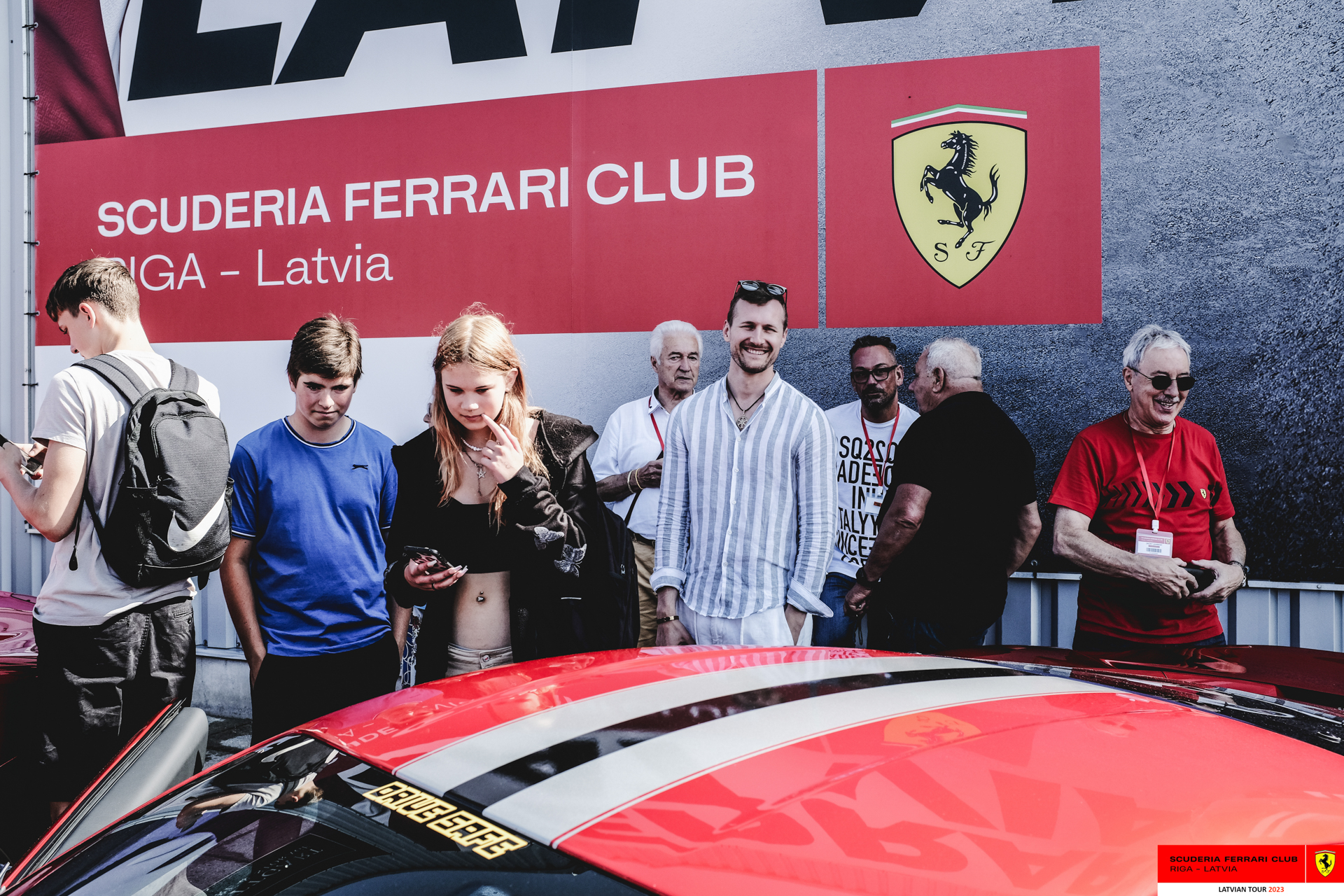 Ferrari owners with some Ferrari fans.